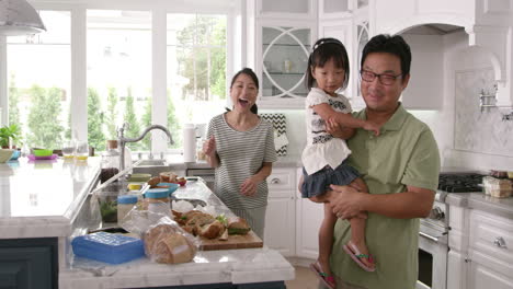 parents prepare food as children play in kitchen on r3d