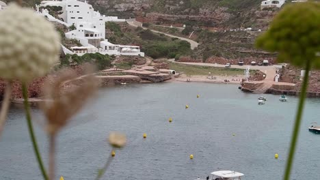cala morell panoramic view, menorca, beach, boats, clear water, and coastal scenery
