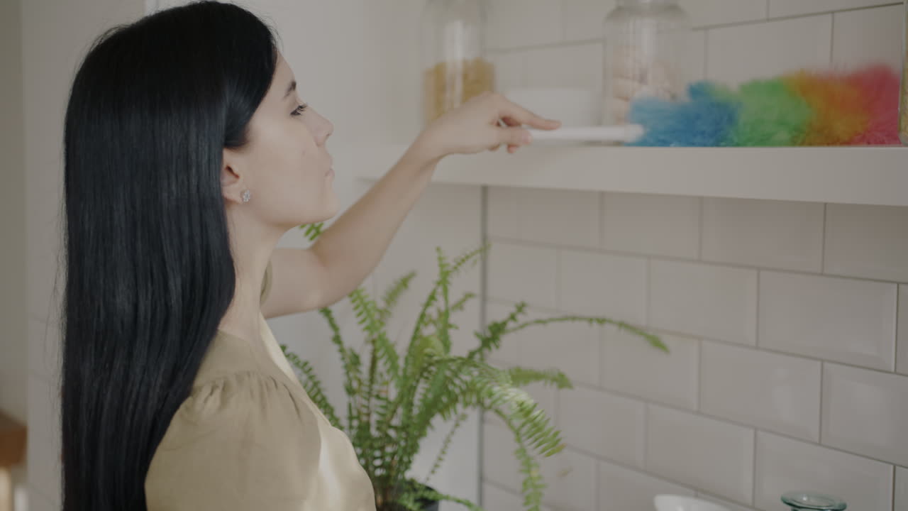 Woman Organizing Kitchen Shelves