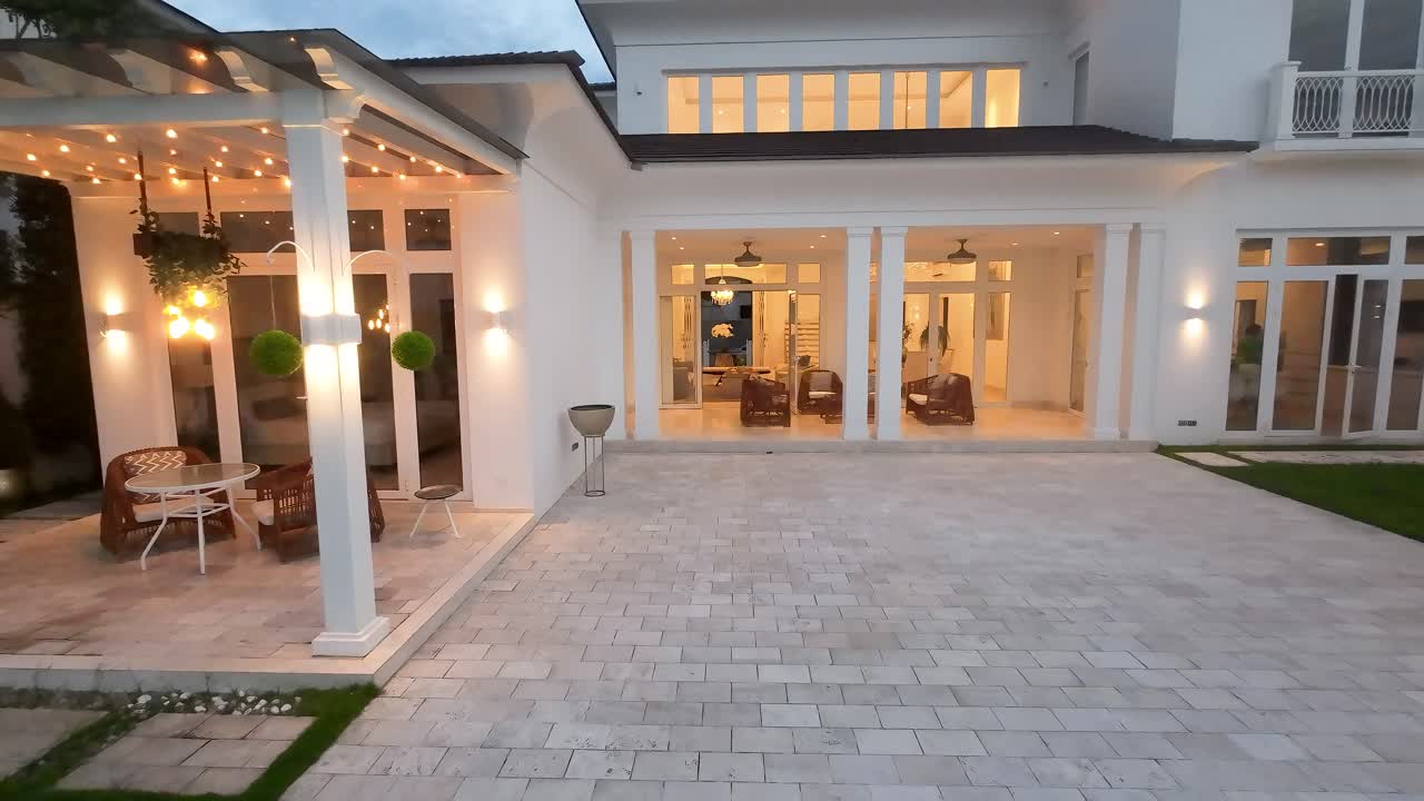 Drone Flying Through Luxury Mansion At Dusk In Lagos de Batan, Guayaquil, Ecuador