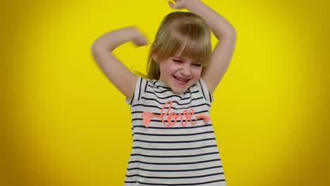 Portrait-of-funny-blonde-kid-child-shouting,-raising-hands-in-gesture-I-did-it,-celebrating-success