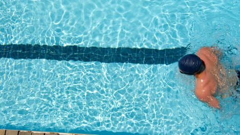 male swimmer swimming inside pool 4k