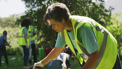 happy family cleaning a garden together