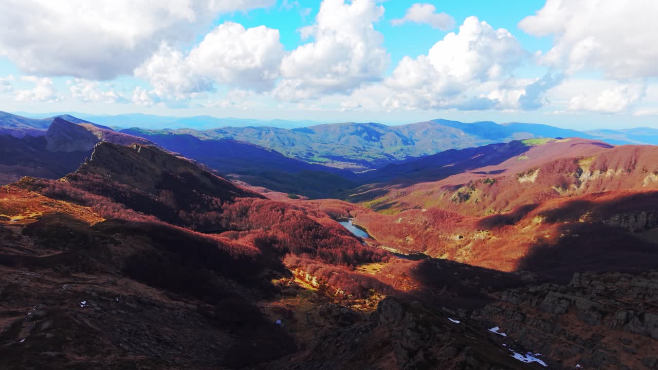 Stunning aerial view of the Dolomites Mountains in warm light and dramatic clouds