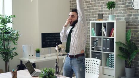 man dancing and singing in the office