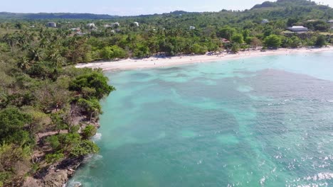 People-at-Playa-La-Playita-beach-at-Las-Galeras-in-Samana-peninsula,-Dominican-Republic