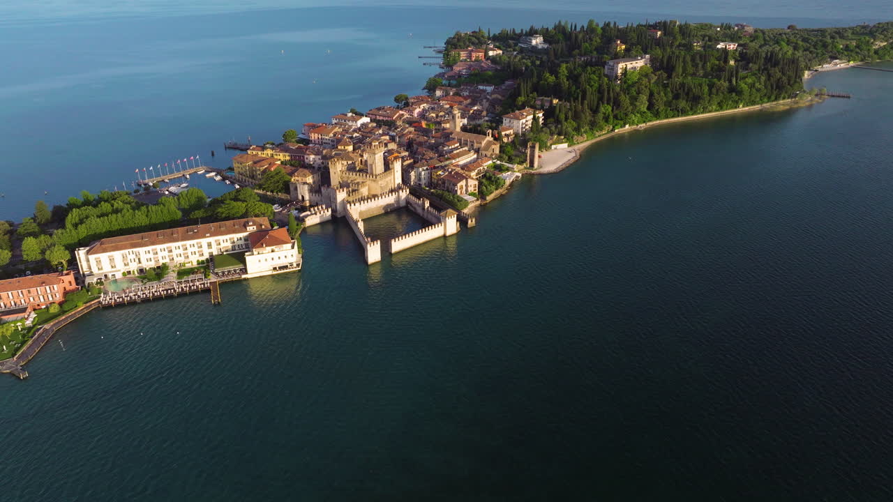 Scaligero Castle, Medieval Port Fortification By Lake Garda In Sirmione, Italy. - aerial shot