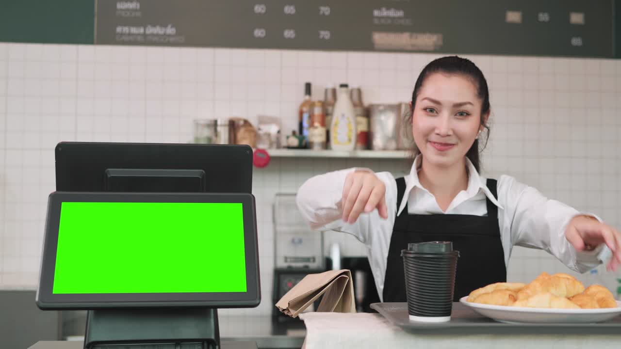 máquina de caja de pantalla táctil con pantalla verde en blanco en una cafetería moderna