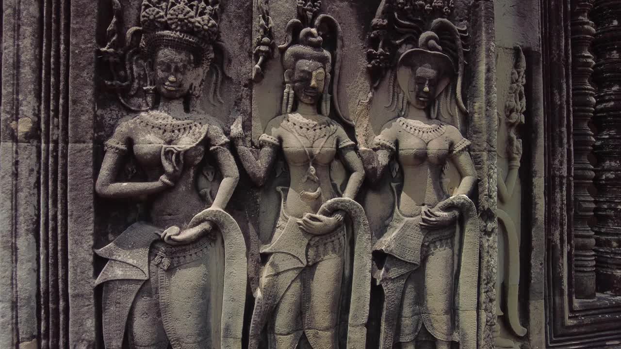 Detail Sculptures Of Khmer Women At Angkor Archaeological Park In Cambodia. Close-up Shot