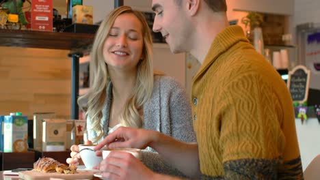 couple interacting with each other in cafe 4k