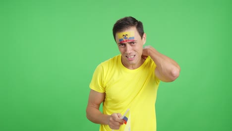 man cheering for ecuador during a match that is lost