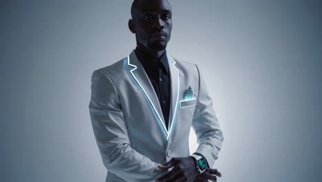 professional man in futuristic glowing suit with smartwatch