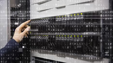 Animation-of-binary-coding-over-caucasian-female-worker-inspecting-server-room