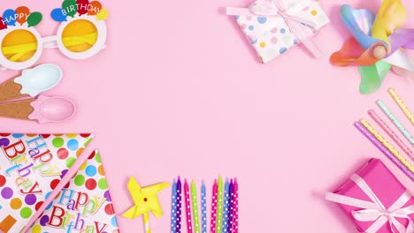 birthday party accessories ordering making frame with happy birthday candles on pastel pink theme. stop motion