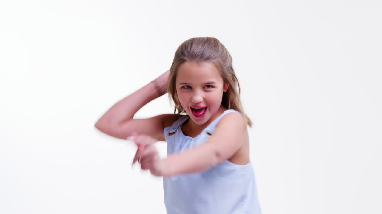 Girl Walks Into Shot And Poses Against White Studio Background