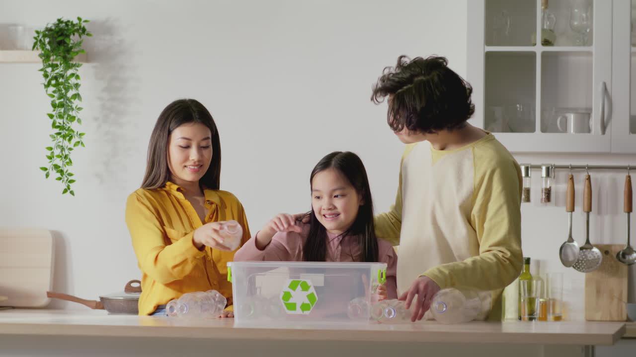 Family Recycling Bottles at Home