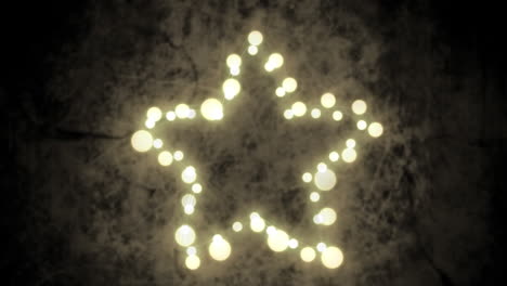 glowing star of fairy lights on grey background