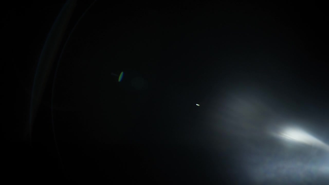 Abstract lens flare fading out to black background