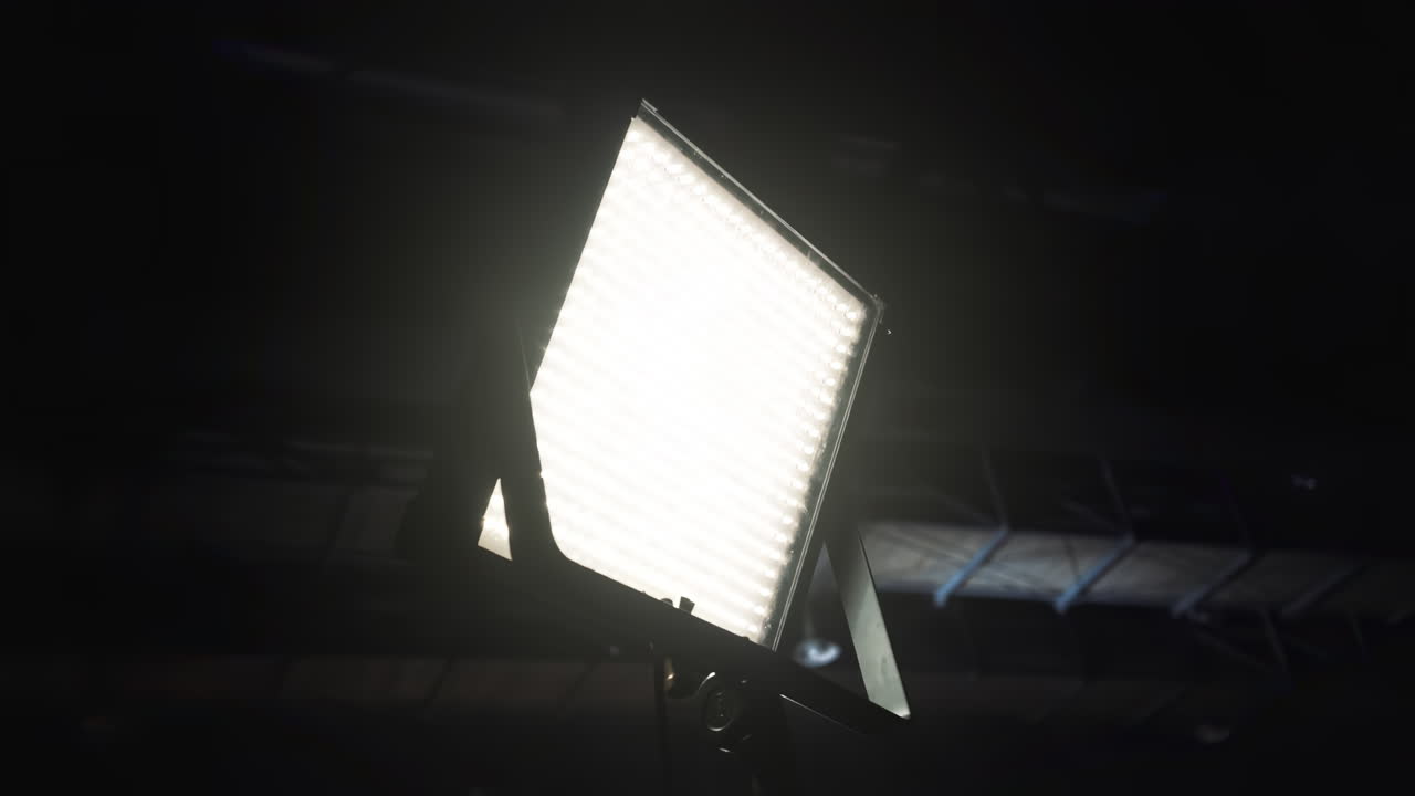 Led lightning system view from below in a pavilion on a movie set. Dark background