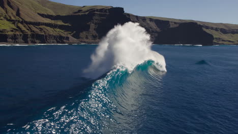 powerful ocean waves crashing against a rocky coast