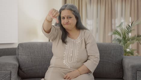 Disappointed-Indian-old-woman-showing-thumbs-down