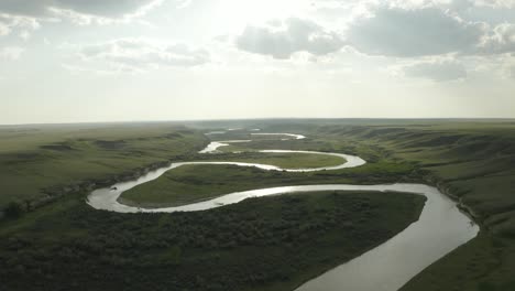 grand winding river through the alberta countryside