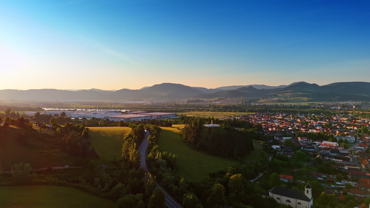 Beautiful rural area in the stunning green valley at sunset. Tatra mountains in Slovakia at backdrop. Aerial view