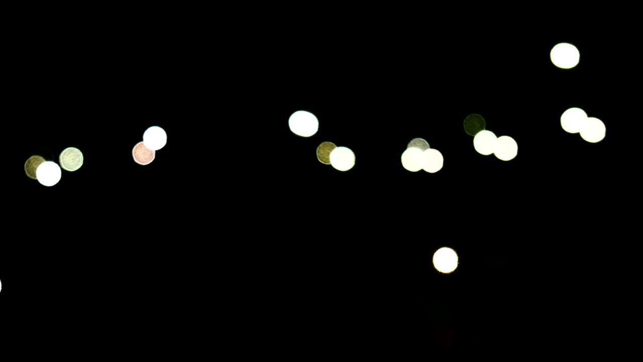 Abstract blur blinking bokeh from lights of mobile phone in night party.