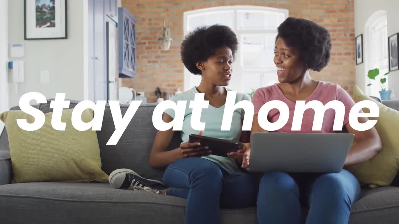 Animation of stay at home text over african american woman and her daughter