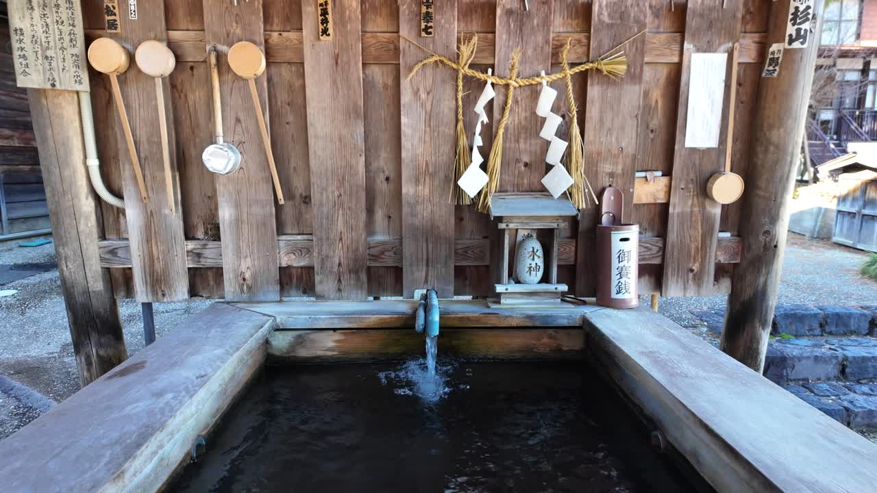Clean water flowing from Miyanosawa Water Source in Narai juku post town, Japan