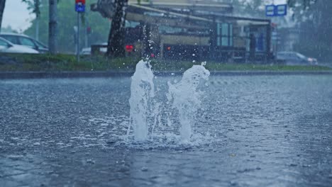 high-pressure rain overflow bursts upward from flooded drainage point