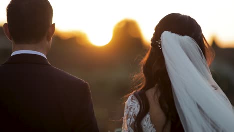 A-bride-and-groom-standing-next-to-each-other