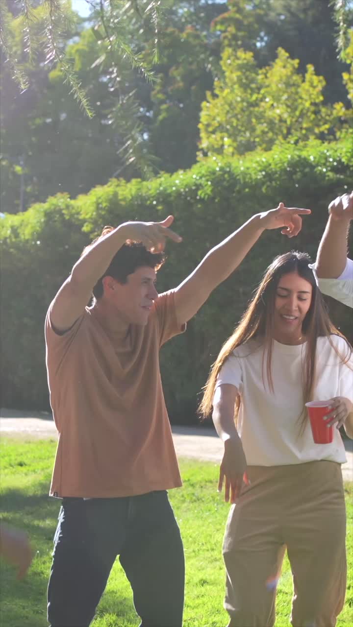 Group of friends celebrating at an outdoor picnic party