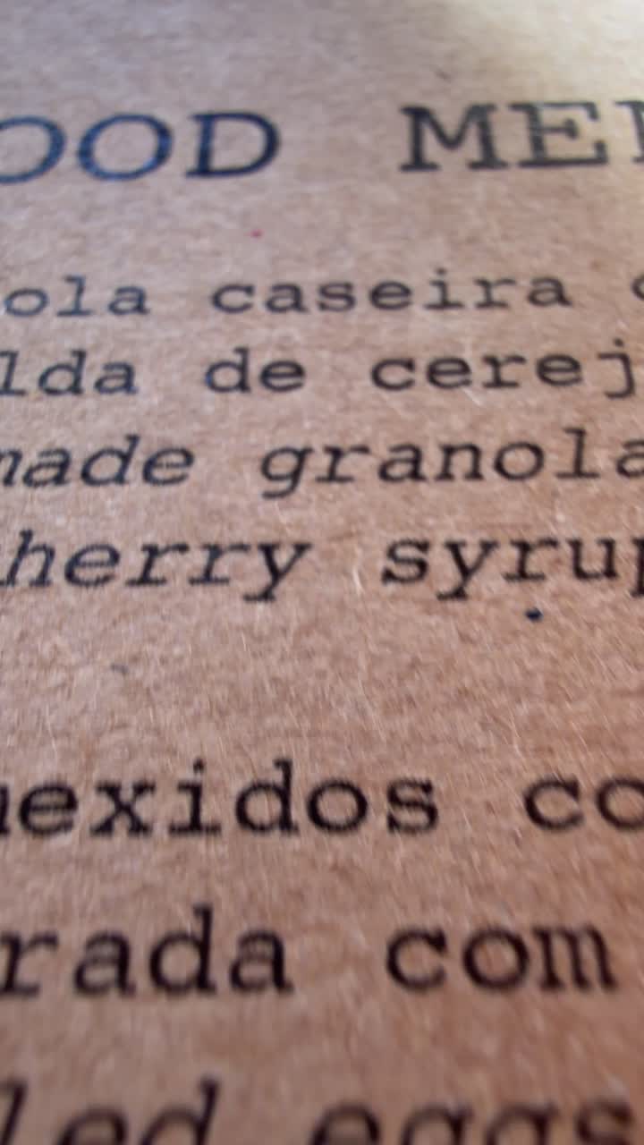 Reading a Food Menu Printed on Brown Textured Paper