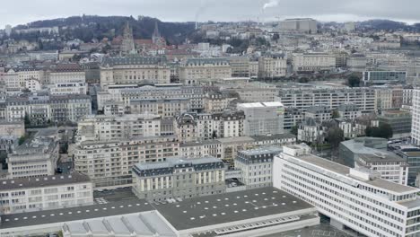 Drone-Aerial-of-the-beautiful-swiss-city-center-of-lausanne-located-on-the-lake-geneva-in-Switzerland-during-winter,-Europe