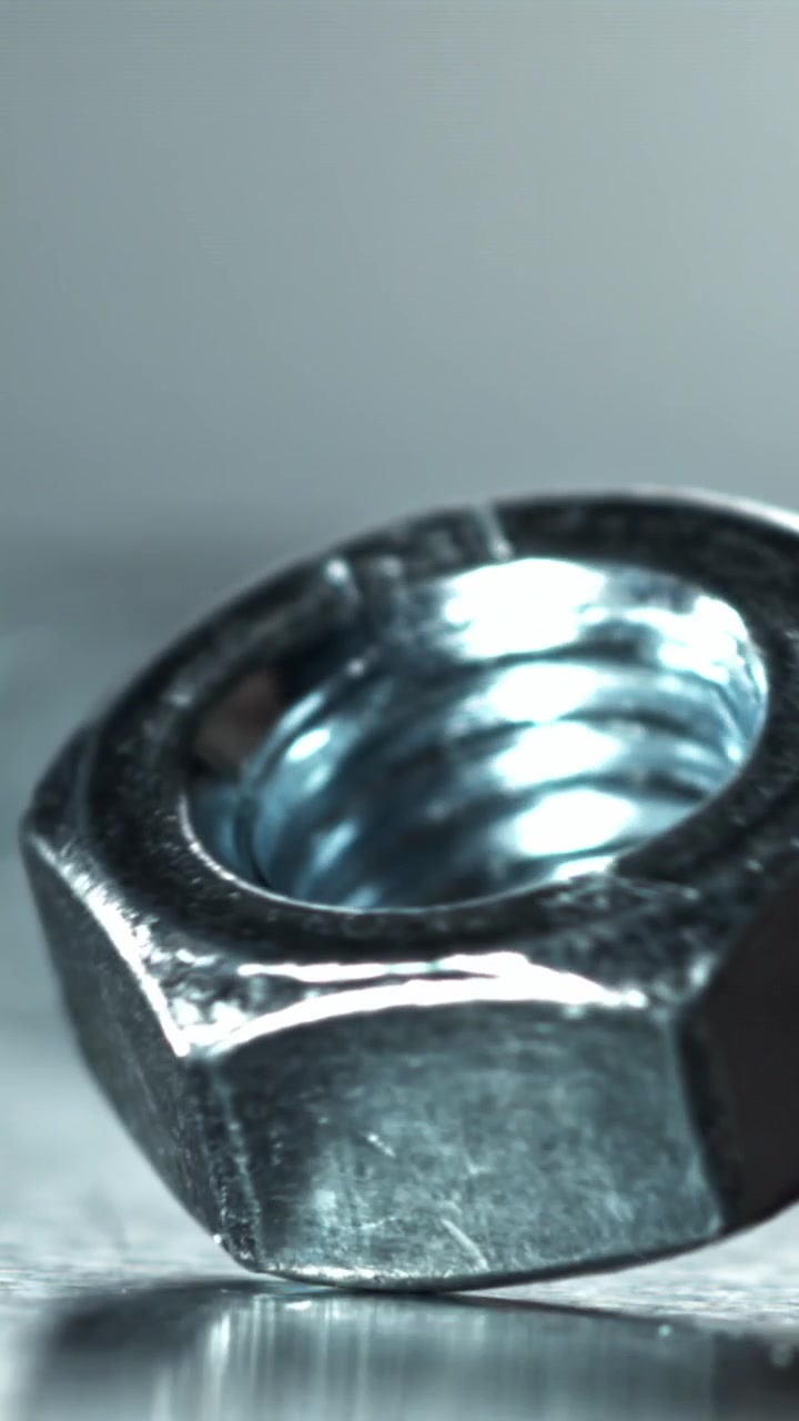 Macro Shot of a Metal Nut Slowly Spinning