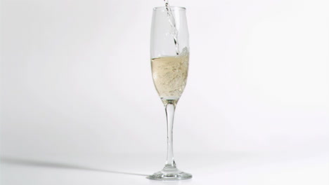 glass filled in super slow motion with champagne