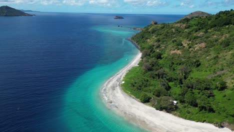 drone fly above white sand beach strip of coastline in comoros island indian ocean marina national park travel destination