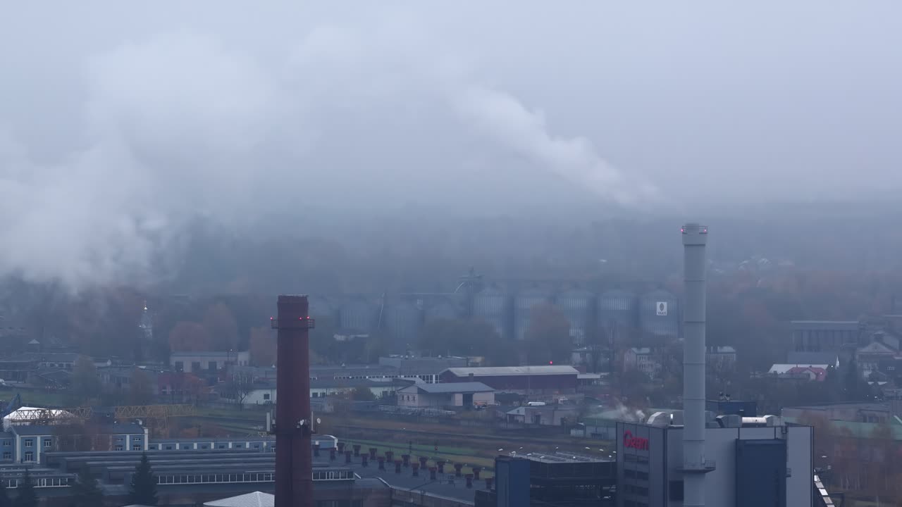 Aerial view of a factory polluting the air with the emissions