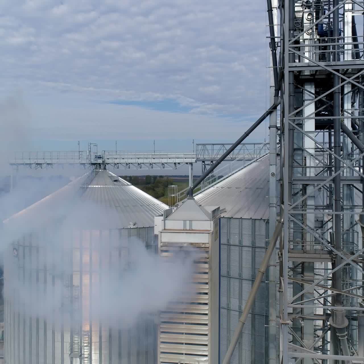 Silos big industrial factory containers. Modern huge metal constructions. Aerial view
