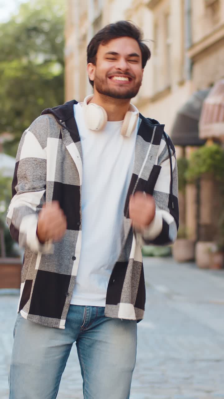Excited happy man traveler shouting celebrating success winning ...