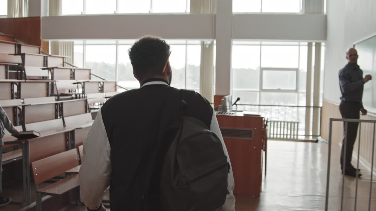 Group of Students Entering Auditorium before Lesson