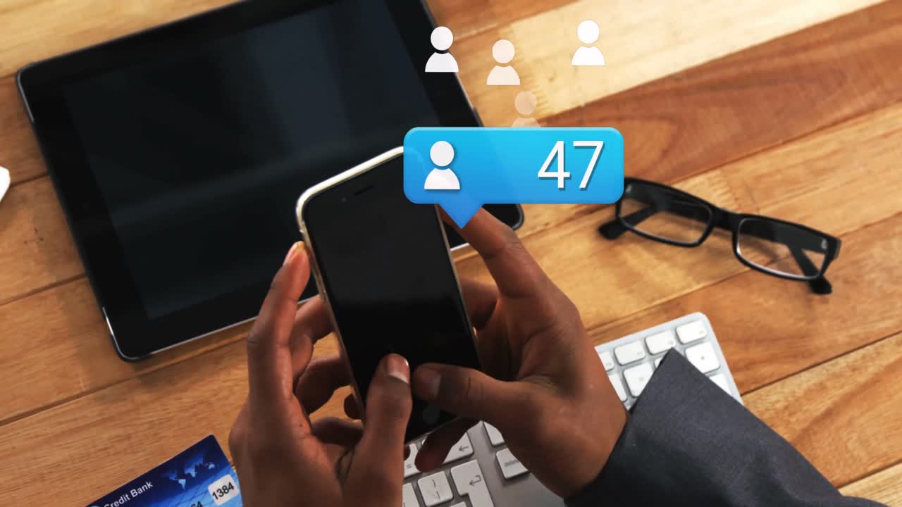 Animation of social media over hands of african american man using smartphone with copy space