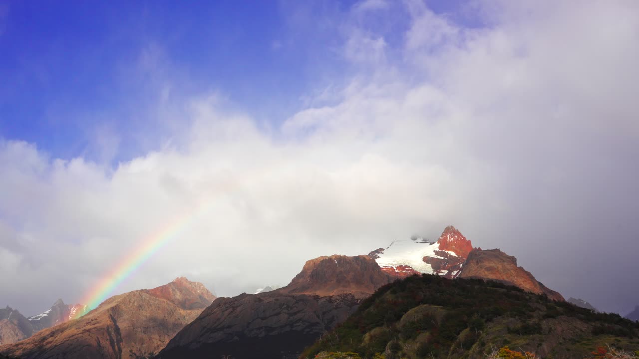Spectacular Time-Lapse view of a rainbow over Cerro Eléctrico near El Chalten town in Patagonia