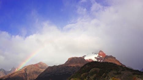 spectacular time-lapse view of a rainbow over cerro eléctrico near el chalten town in patagonia
