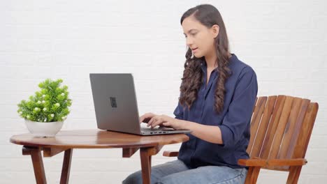 Indian-girl-working-from-a-cafe