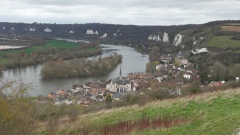 Scenic-view-of-les-andelys,-river-bend-and-quaint-village,-overcast-day