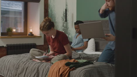 girl taking notes on the bed in bedroom