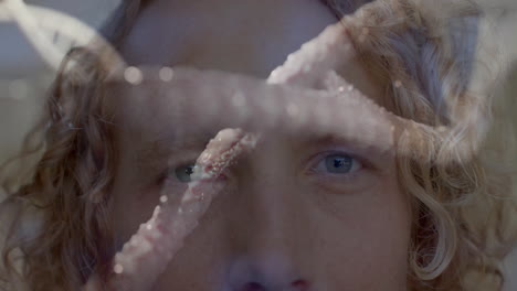 starfish animation over close-up of person face with curly hair