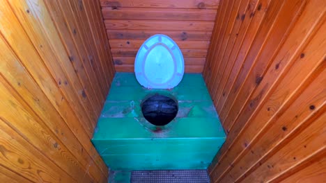 composting toilet interior on the remote countryside of a former soviet country